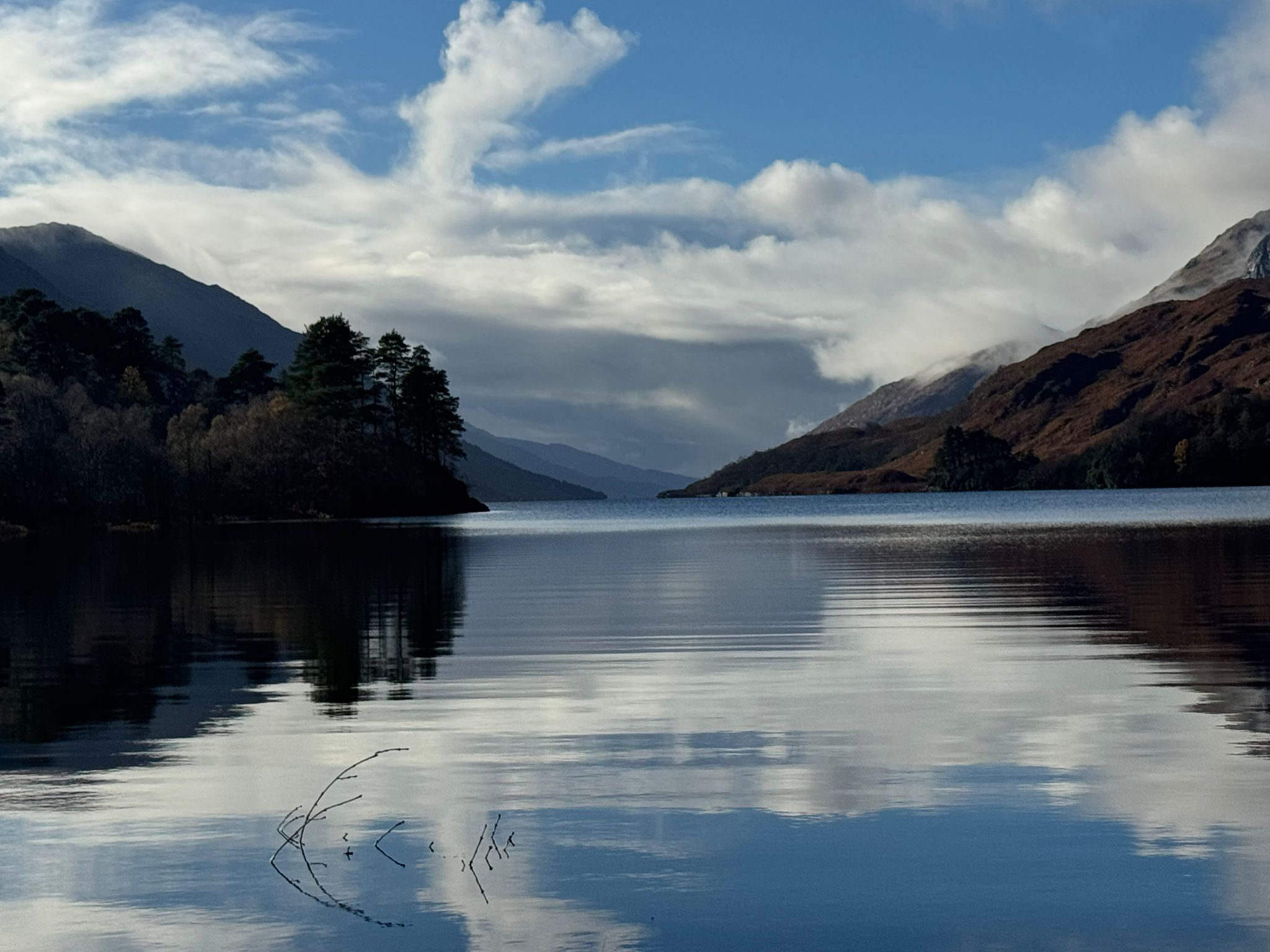 Highland loch surrounded by rolling hills